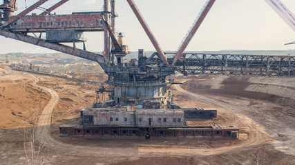The operating machines in the quarry for the extraction of manganese ore