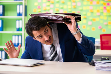 Businessman with many conflicting priorities   