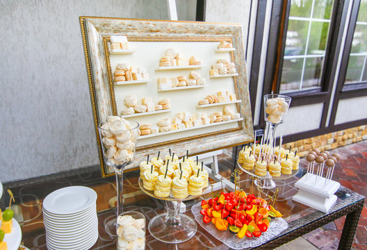 candy bar at the wedding. Original decorated in the form of a picture