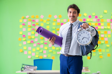 Sportive man in the office with many conflicting priorities in t
