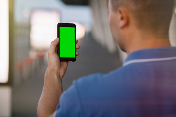 Cropped shot view of a man's hands holding cell telephone,