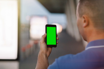 Cropped shot view of a man's hands holding cell telephone,