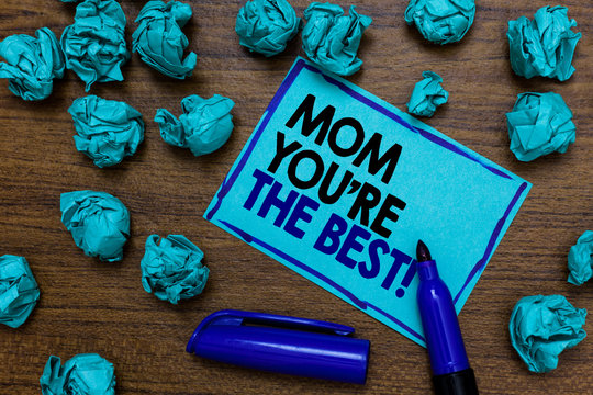 Conceptual hand writing showing Mom You re are The Best. Business photo showcasing Appreciation for your mother love feelings compliment written blue letters on page blue marker and paper lumps.