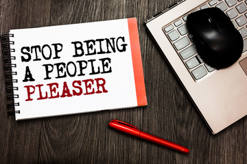 Conceptual hand writing showing Stop Being A People Pleaser. Business photo showcasing Do what you like not things other people want Bluetooth mouse on keyboard words red pen on wooden deck.