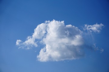 Naklejka na ściany i meble Amazing white fluffy cumulus clouds on the background of clear blue sky, summer in GA USA.