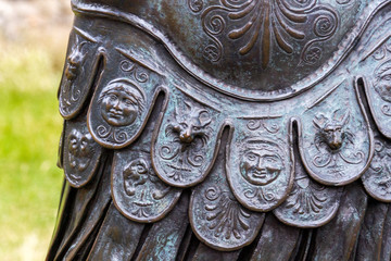 Detail of a bronze sculpture showing showing the masterfully crafted and inlayed bronze o...