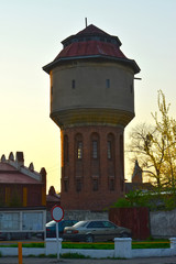 Old water tower at sunset. Chernyakhovsk, Kaliningrad region