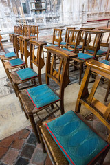 Wooden Chairs in a Cathedral