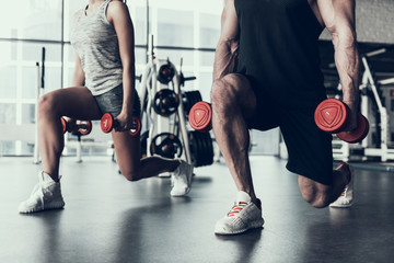 Close up. Man and Woman Training in Fitness Club. - obrazy, fototapety, plakaty