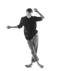 Young beautiful dancer is posing in studio