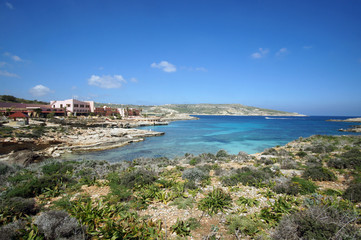 Fototapeta na wymiar Abandoned hotel next to the beach on Comino (Kemmuna) Island, Malta