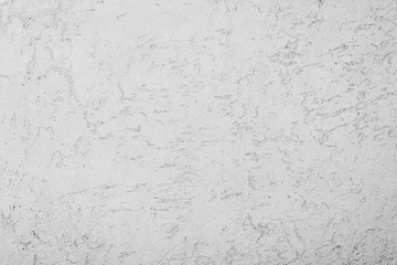 texture of the surface of the wall covered with decorative plaster of the woodworm type