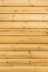 texture of horizontal wooden panels, wall of yellow boards, abstract background