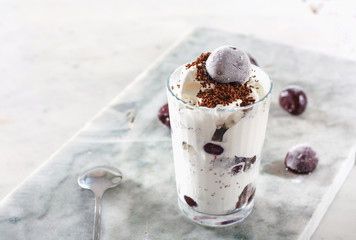 Ice cream with cherry berries on  marble countertop background