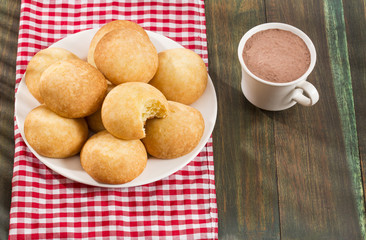 Almojabana, traditional Colombian food - Drink of chocolate. Top view