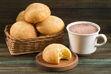 Almojabana, traditional Colombian food - Drink of chocolate. Top view