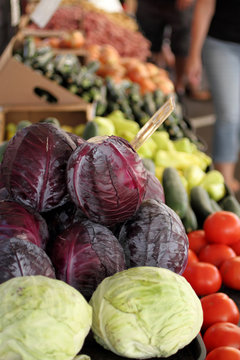 Neat stacks of produce at a farmer's market.