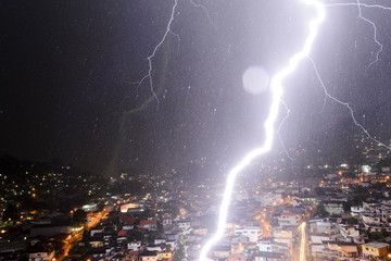 Lightning strikes so near on suburb in a brazilian neighborhood, during a thunderstorm in the city of Teresópolis, in Rio de Janeiro.  December 19, 2015.