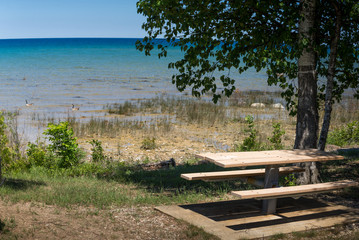 Fototapeta na wymiar Picnic table at Lake Michigan