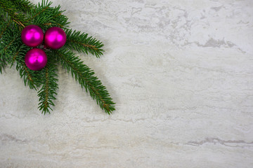 Christmas ornaments on a spruce bough with copy space