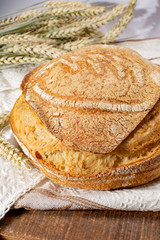 Sourdough homemade round white wheat bread close up