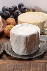 Fototapeta na wymiar Belgian white mold soft cow milk cheese Bouquet des Moines from Abbey of Val-Dieu close up