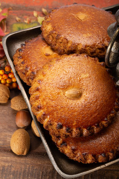 Round Dutch homemade cookies filled with marzipan and almonds nuts, autumn and winter seasonal dessert in Netherlands