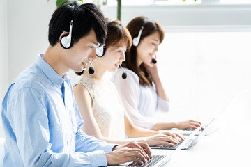 asian operator working in office