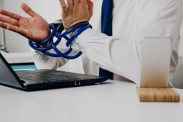 Work in the office, the man has tied hands. The concept of helplessness and powerlessness. The...