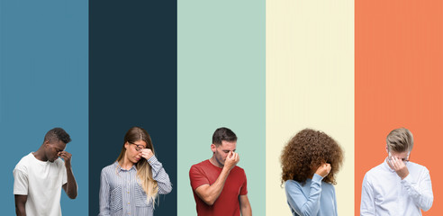 Group of people over vintage colors background tired rubbing nose and eyes feeling fatigue and headache. Stress and frustration concept.