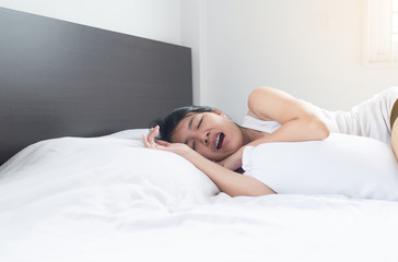 Asian woman snoring because due to tired of work,Female snor while sleeping on bed