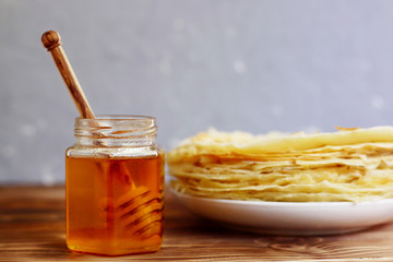 pancake with  spoon for honey