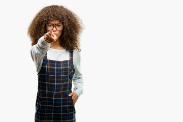 African american woman wearing a retro style pointing with finger to the camera and to you, hand...