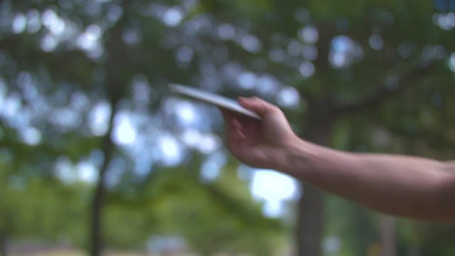Slow-motion footage of a man throwing a frisbee golf disc.  Shot on a Blackmagic Ursa Mini Pro 4.6k with a Sigma 50-100mm f/1.8.