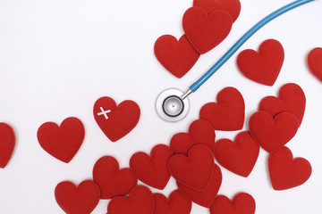 Plakat Red heart with stethoscope isolated on white background