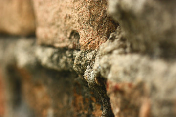 selective focus of very old brown brick wall
