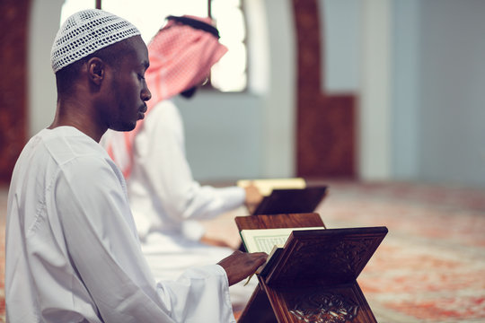 Two Religious muslim man praying inside the mosque