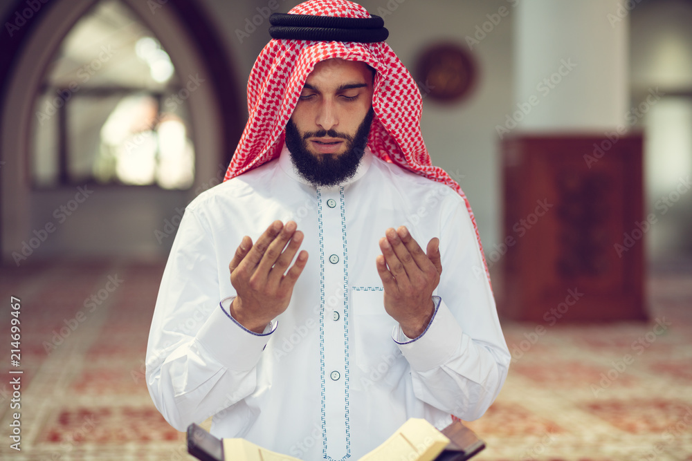 Wall mural religious muslim man praying inside the mosque