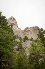 Fototapeta na wymiar George Washington and Abraham Lincoln at Mount Rushmore Against a White Sky Background