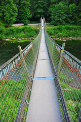 Obraz premium Adventurous footbridge over river