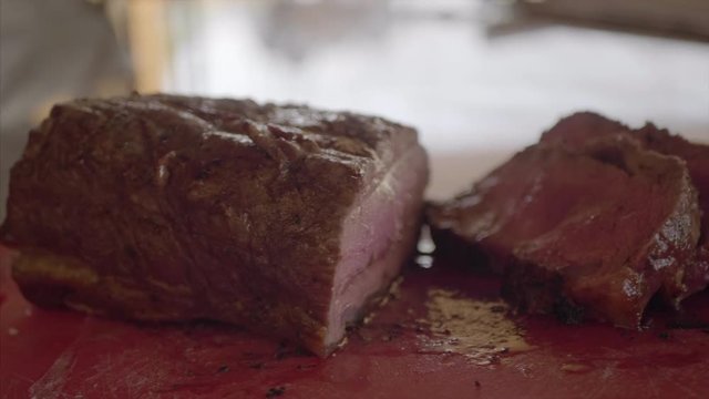 Finished bbq, juicy meat cut on the cutting table