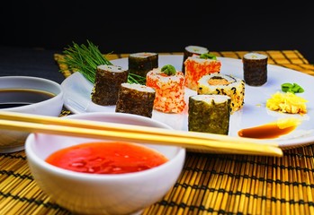 Fresh and delicious sushi Japanese food. Image of Japanese food. Sushi rolls served on a plate in a restaurant