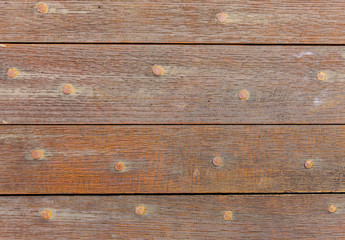 Old boards and metal rivets. Backgrounds and textures