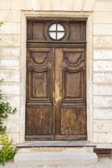 Fototapeta na wymiar The ancient wooden door in Spain