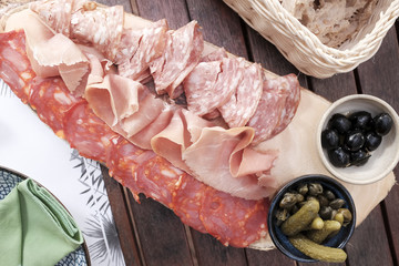 Cold cut of parma ham or iberico with cucumber pickles and bread