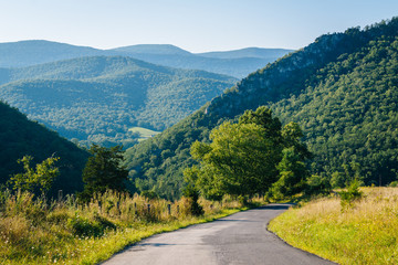 Fototapeta na wymiar A road and view of mountains in the rural Potomac Highlands of West Virginia.