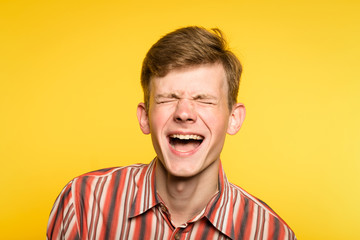 lol lmfao. man laughing hard. joy happiness humor and wide cheerful smile concept. portrait of a...