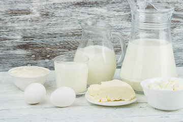 Different dairy products on the, wooden background