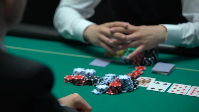 Confident gambler making bet on losing combination, going all-in, addiction