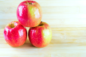 Red apple on wooden background.domination, career concepts. Copy space.